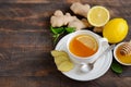 Ginger root tea with lemon and honey on wooden background. Royalty Free Stock Photo