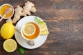 Ginger root tea with lemon and honey on wooden background. Royalty Free Stock Photo