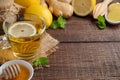 Ginger root tea with lemon and honey on wooden background Royalty Free Stock Photo