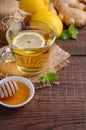 Ginger root tea with lemon and honey on wooden background Royalty Free Stock Photo