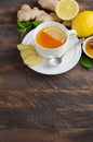 Ginger root tea with lemon and honey on wooden background. Royalty Free Stock Photo