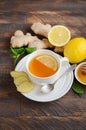 Ginger root tea with lemon and honey on wooden background. Royalty Free Stock Photo