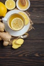 Ginger root tea with lemon and honey on wooden background Royalty Free Stock Photo