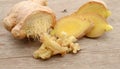 Ginger root on the wooden background. Top view Royalty Free Stock Photo