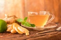 Ginger tea - Cup of ginger tea with green lemon Royalty Free Stock Photo