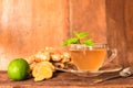 Ginger tea - Cup of ginger tea with green lemon Royalty Free Stock Photo