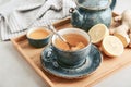 Ginger tea with lemon in a blue cup Royalty Free Stock Photo