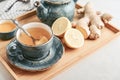 Ginger tea with lemon in a blue cup Royalty Free Stock Photo