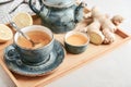 Ginger tea with lemon in a blue cup Royalty Free Stock Photo