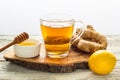 Ginger tea with lemon and honey on a white wooden background. Hot healthy winter drink Royalty Free Stock Photo