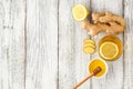 Ginger tea with lemon and honey on a white wooden background. Hot healthy winter drink Royalty Free Stock Photo