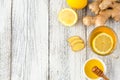 Ginger tea with lemon and honey on a white wooden background. Hot healthy winter drink Royalty Free Stock Photo