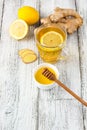 Ginger tea with lemon and honey on a white wooden background. Hot healthy winter drink Royalty Free Stock Photo