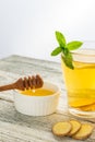 Ginger tea with lemon mint and honey on a white wooden background. Hot healthy winter drink Royalty Free Stock Photo
