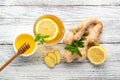 Ginger tea with lemon mint and honey on a white wooden background. Hot healthy winter drink Royalty Free Stock Photo