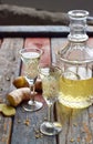 Ginger tincture or ale on wooden background. Spice yellow liqueur in a glass. Homemade Alcohol drink. Rustic style Royalty Free Stock Photo