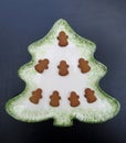 Gingerbread angels on Christmas tree shape plate Royalty Free Stock Photo