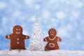 Gingerbread boy and girl with Shinny Glass Christmas Tree