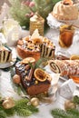 Gingerbread cake with chocolate glaze and poppy seed pastries on Christmas table Royalty Free Stock Photo