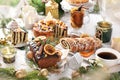 Gingerbread cake with chocolate glaze and poppy seed pastries on Christmas table Royalty Free Stock Photo