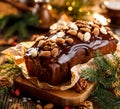 Gingerbread cake, Christmas gingerbread cake covered with chocolate and decorated with nuts and almonds on the holiday table.