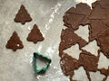 Gingerbread Christmas cookie dough rolled and cut into tree shapes Royalty Free Stock Photo