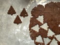 Gingerbread Christmas cookie dough rolled and cut into tree shapes Royalty Free Stock Photo