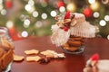 Gingerbread Christmas cookies  in the glass jar.  Christmas spices and decor close up. Festive background with bokeh and light.  N Royalty Free Stock Photo