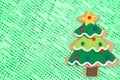 Gingerbread Christmas tree on green sparkle background