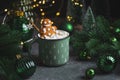 Gingerbread Cookie Man into Christmas Mug with Marshmallows and Festive Decor Royalty Free Stock Photo