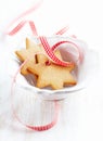 Gingerbread cookies with check ribbon in a bowl. Christmas time.