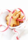 Gingerbread cookies with check ribbon in a bowl. Christmas time.