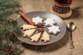 Gingerbread cookies in Christmas tree and star shape on plate Royalty Free Stock Photo