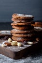 Gingerbread cookies dusted with icing sugar on a wooden table