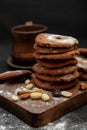 Gingerbread cookies dusted with icing sugar on a wooden table