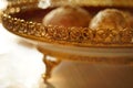 Gingerbread cookies in golden plate with a carved patterned side