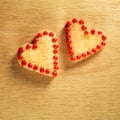 Gingerbread cookies hanging over wooden background