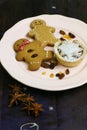 Gingerbread cookies and mince pie on ceramic plate