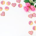 Gingerbread cookies and roses on white background. Frame, copy space. Flat lay. top view. Royalty Free Stock Photo