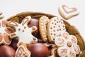 Gingerbread cookies in the shape of an Easter bunny, flowers and hearts, covered with white and chocolate icing-sugar, and easter Royalty Free Stock Photo