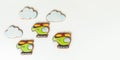 Gingerbread cookies in the shape of military helicopters flying in the clouds. Army or Men`s day. Flat lay on white