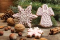 Gingerbread cookies snowflakes, angel, fir tree branch. Christmas New Year holiday decor. Royalty Free Stock Photo