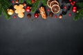 Gingerbread cookies, spices and Christmas decorations at black. Royalty Free Stock Photo