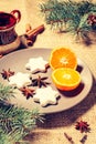 Gingerbread cookies in star shape and orange on plate Royalty Free Stock Photo