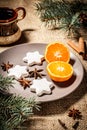 Gingerbread cookies in star shape and orange on plate Royalty Free Stock Photo