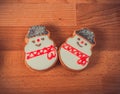 Gingerbread cookies on wood background.Snowman, deer, fir-tree, boot, Santa Claus, mitten.