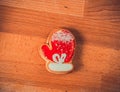 Gingerbread cookies on wood background.Snowman, deer, fir-tree, boot, Santa Claus, mitten.