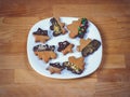 Gingerbread cookies on wood background.Snowman, deer, fir-tree, boot, Santa Claus, mitten.