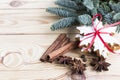 Gingerbread cookies on a wooden background with spices and a Christmas tree branch. Christmas and New Year holidays. Royalty Free Stock Photo