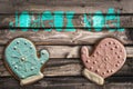 Gingerbread cookies on wooden background and text joyeux noel meaning merry christmas Royalty Free Stock Photo